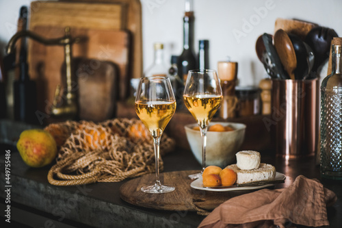 Orange or Amber wine in glasses over kitchen counter