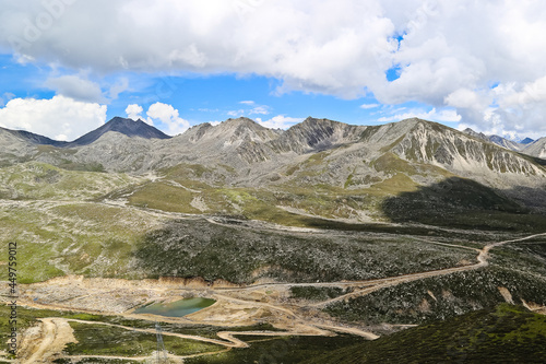 Zheduo mountains and valley with winding road Sichuan China photo