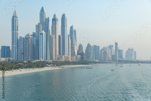 scenery of skyscrapers  beach and ocean in dubai  united arab emirates