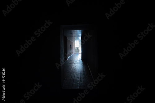 Dark corridor. Mystical interior of dark empty corridor, tunnel in an abandoned house. Dark mysterious corridor. The interior of an abandoned house, road to hell.