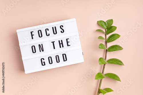 Lightbox with text focus on the good. Mental health, positive thinking, emotional wellness concept. Flat lay, top view