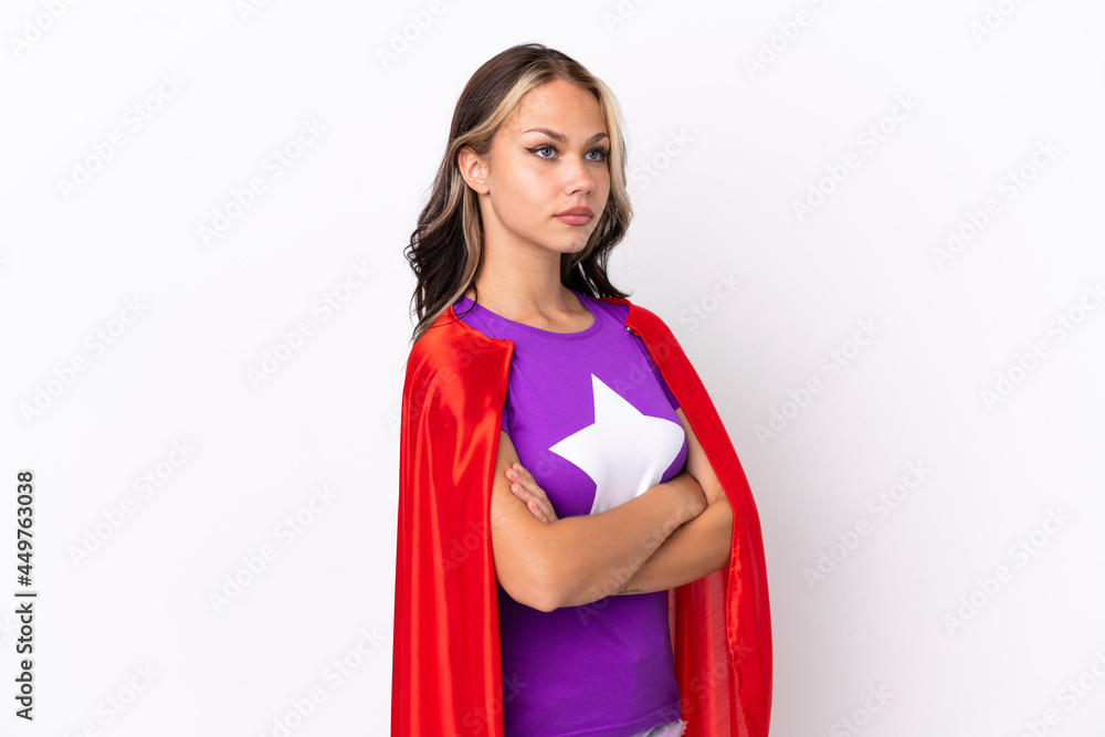 Teenager Russian girl isolated on white background in superhero costume with arms crossed Teenager Russian girl isolated on white background in superhero costume with arms crossed