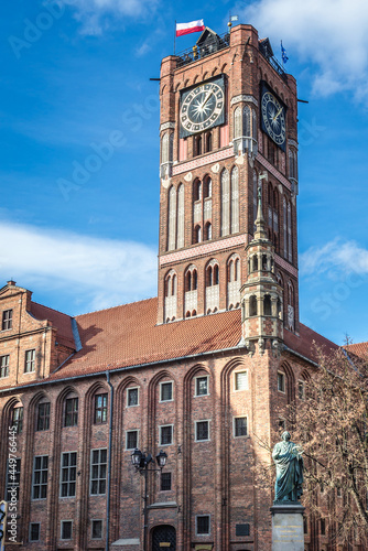 Old Town City Hall and Copernicus monument in historic part of Torun city, Poland