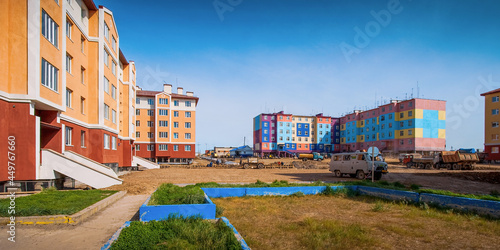 Courtyard of a northern urban-type settlement. Colorful residential buildings. Improvement in settlements in the Far North of Russia in the Arctic. Everyday life in Russia. Ugolnye Kopi, Chukotka. photo