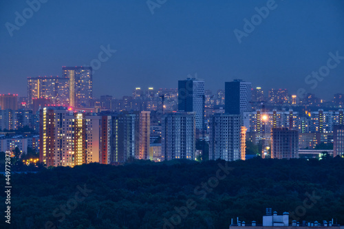 Moscow, Russia - May 26, 2021: Night view from the Cosmos Hotel on the buildings of the city of Moscow. The surroundings around VDNKh and Ostankino TV Tower.