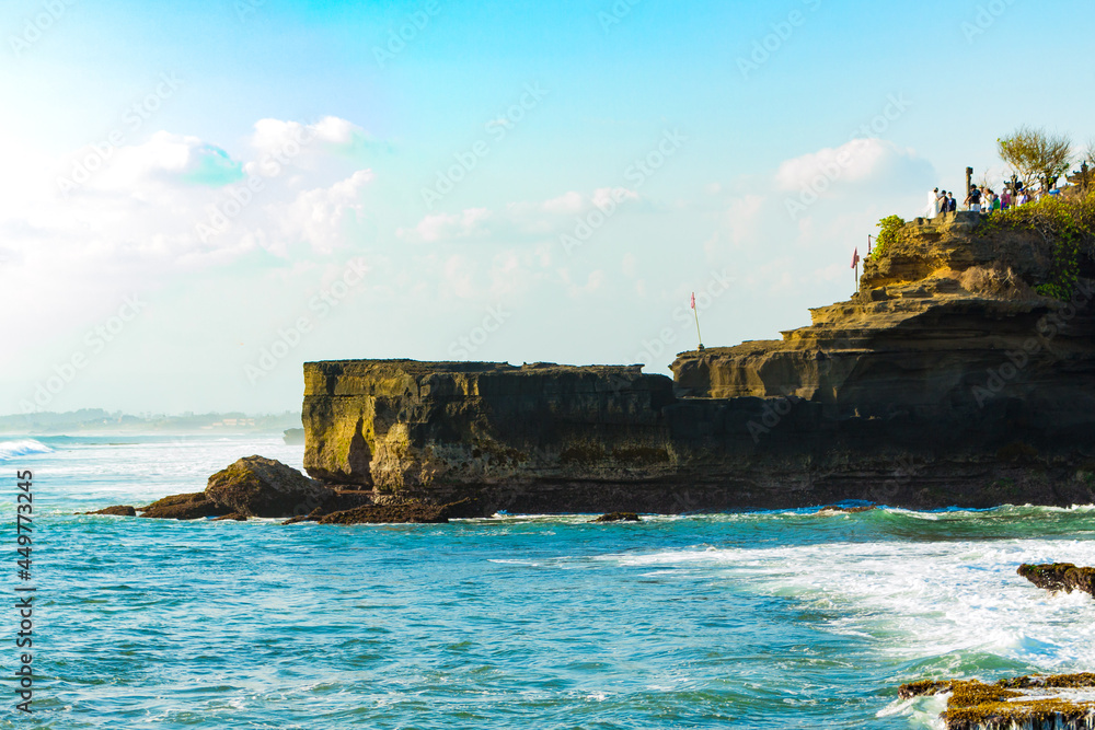 Bali, Indonesia - Oct 14, 2015: Tanah Lot Temple, located on the water at low tide.
