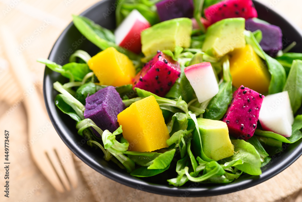 Healthy vegan salad fruits and vegetables with avocado, dragon fruit, radish, pumpkin and corn salad in a bowl Healthy vegan salad fruits and vegetables with avocado, dragon fruit, radish, pumpkin and corn salad in a bowl