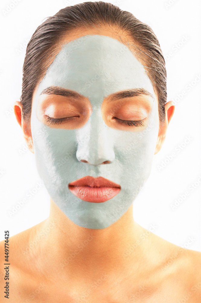 Studio shot of woman with blue facial mask Studio shot of woman with blue facial mask