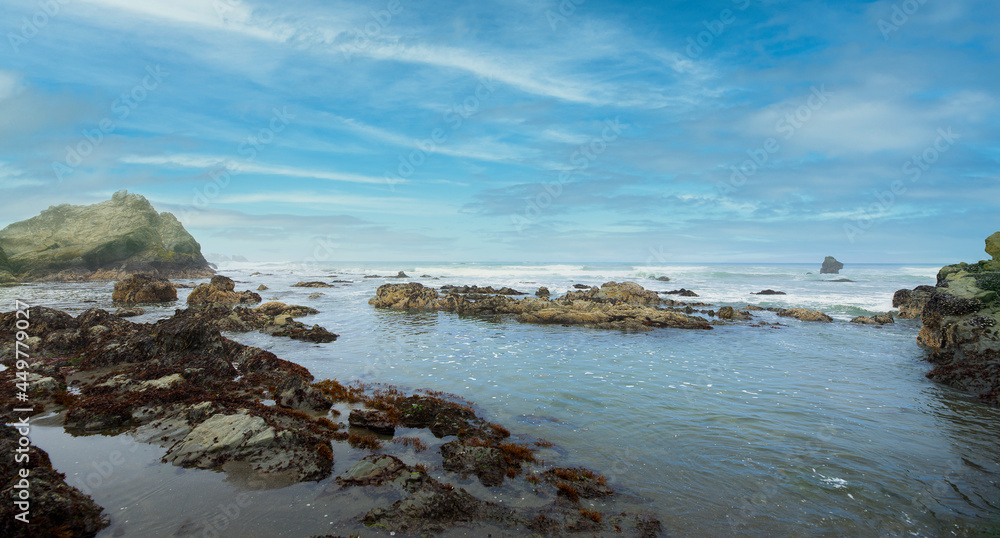 Panoramic view rocks and  ocean of Northern California coastline under beautiful blue sky