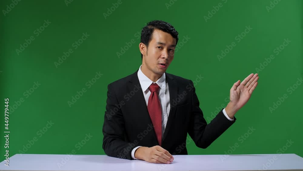 Green Screen Background: Live News Studio With Professional Asian Male Anchor Reporting On The Events Of The Day. Television Channel Newsroom Concept. Chroma Key Template Background
Green Screen Background: Live News Studio With Professional Asian Male Anchor Reporting On The Events Of The Day. Television Channel Newsroom Concept. Chroma Key Template Background