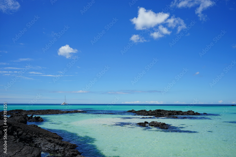 a beautiful seascape with clear water and charming clouds
