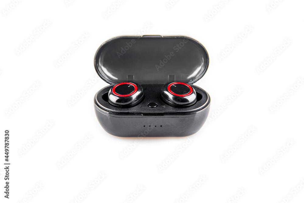 Close-up of wireless earphones in a recharging box on a white background.