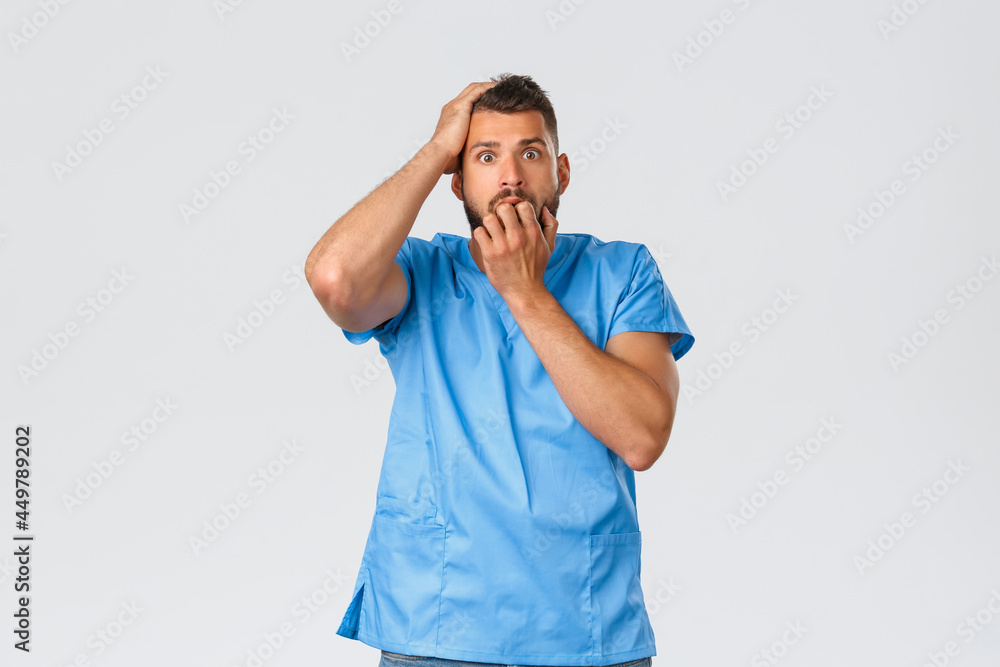 Healthcare workers, medicine, covid19 and pandemic selfquarantine concept. Nervous male nurse