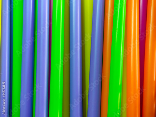 closeup colorful rainbow plastic straws abstract background  disposable straw for beverage