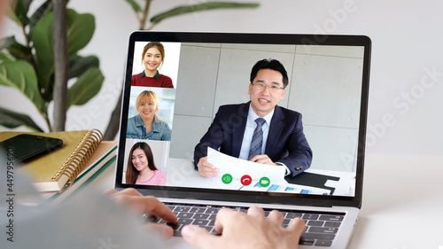 Video conference, Work from home, Asian man and woman making video call to business team with virtual web, Contacting asia colleagues group by conference on laptop computer at home