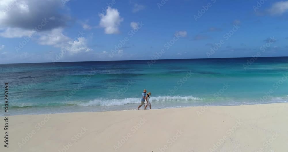 unrecognizable Couple walking in white Beach Aerial view, Camera Moving point of interest Fantastic, landscape Caribbean Sea unrecognizable Couple walking in white Beach Aerial view, Camera Moving point of interest Fantastic, landscape Caribbean Sea