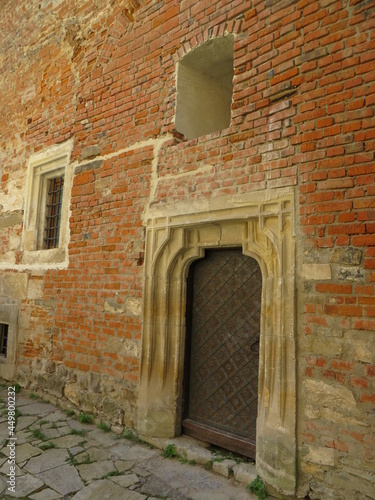 old windows and doors on a brick wall  the atmosphere of the castle