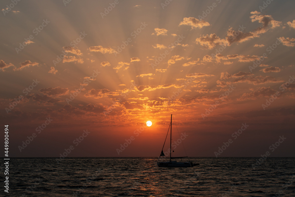 A sunrise seen from the beach of the sea A sunrise seen from the beach of the sea