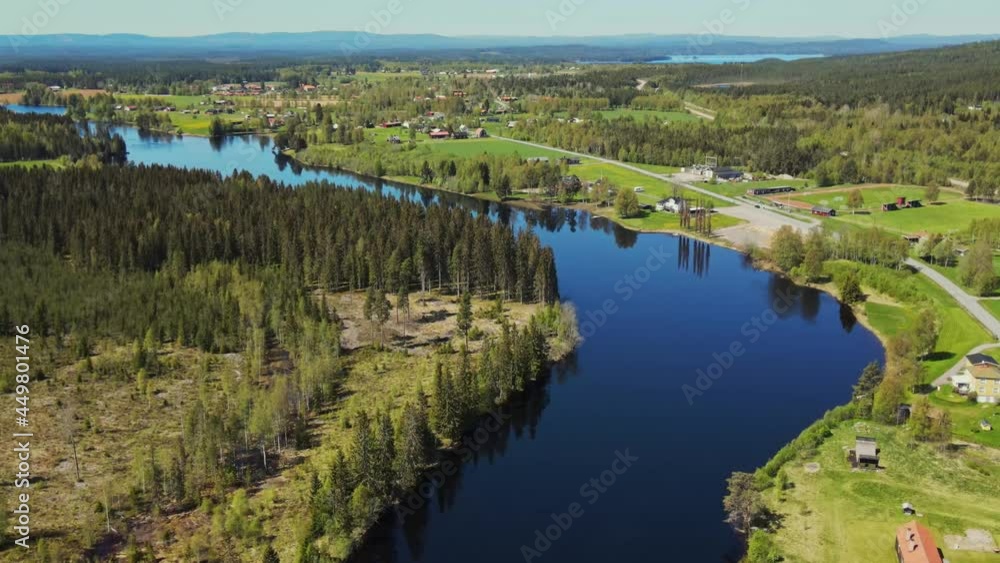 Countryside Landscape With Coniferous Forest And Calm Lake Water, Appelbo, Dalarna, Sweden - aerial shot Countryside Landscape With Coniferous Forest And Calm Lake Water, Appelbo, Dalarna, Sweden - aerial shot