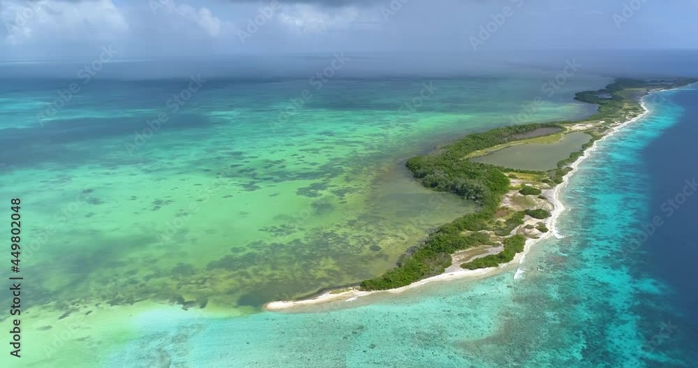 Moving-turn pan LEFT aerial view bocade Cote island and nube verde Caribbean sea Los roques Venezuela with blue water and Green mangrove. Moving-turn pan LEFT aerial view bocade Cote island and nube verde Caribbean sea Los roques Venezuela with blue water and Green mangrove.