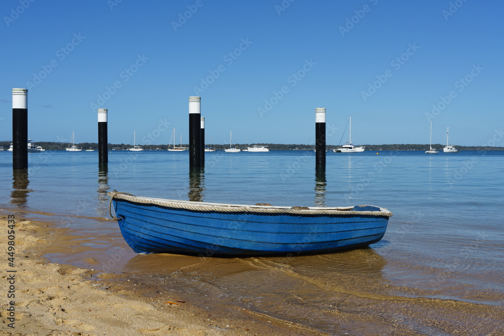 Blue row boat on the beach on Coochiemudlo Island 