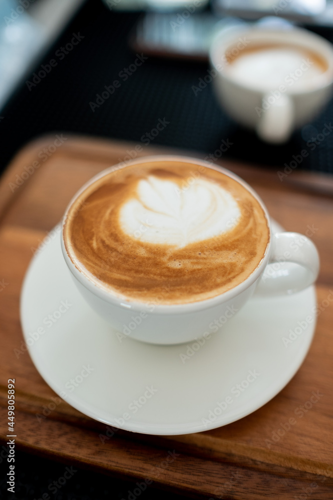 hot latte art coffee on wood table, relax time hot latte art coffee on wood table, relax time