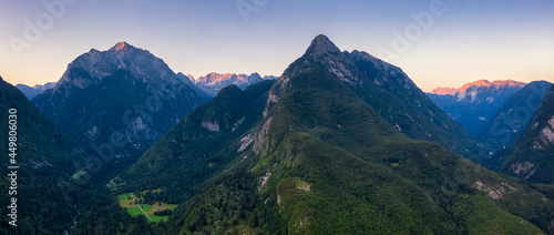 Panoramic view of Mount Svinjak and the surrounding Julian alps at sunset