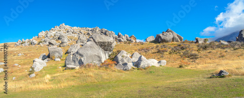 panoramic view of Castle Hill on sunshine day. Majestic limestone rock formations at Castle Hill, Canterbury, South Island of New Zealand. photo