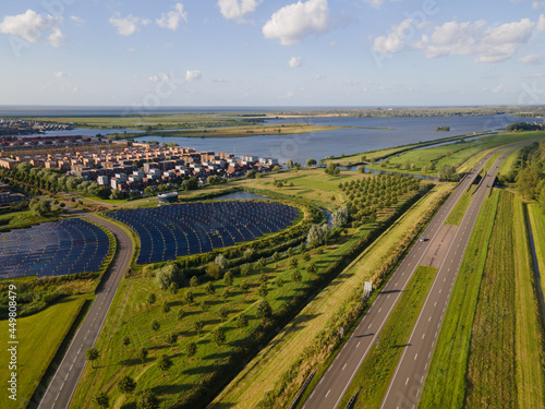 Modern innovative residential area in Almere, along the waterside, including solar panel field. The Netherlands, Flevoland. photo