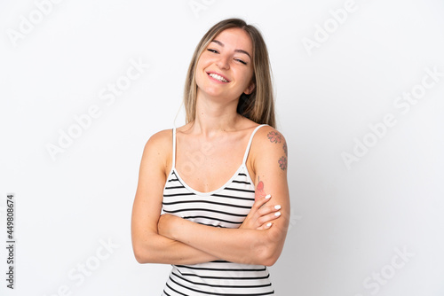 Young Romanian woman isolated on white background keeping the arms crossed in frontal position © luismolinero