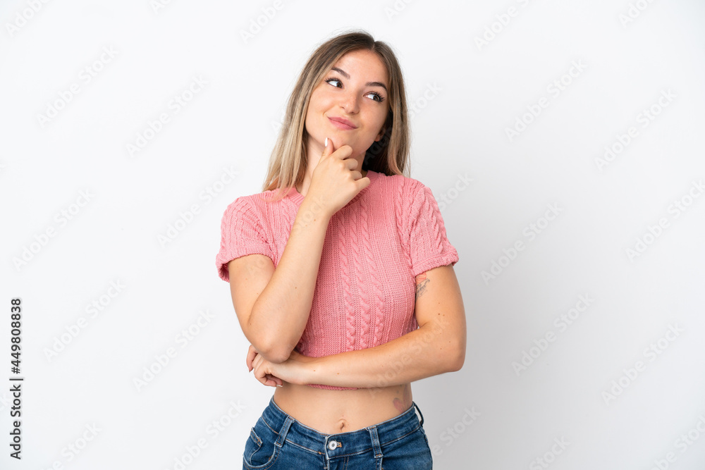 Young Romanian woman isolated on white background thinking an idea while looking up Young Romanian woman isolated on white background thinking an idea while looking up