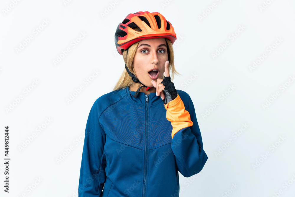 Young blonde Uruguayan cyclist woman isolated on background intending to realizes the solution while lifting a finger up Young blonde Uruguayan cyclist woman isolated on background intending to realizes the solution while lifting a finger up