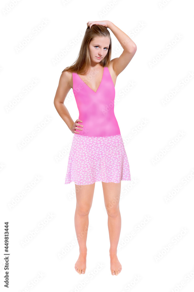 Attractive young women wearing a pink swimsuit and a short summer skirt, full length portrait, isolated in front of white studio background