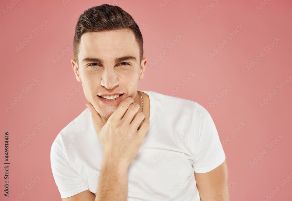 smiling man in white t-shirt cropped view pink background attractive view smiling man in white t-shirt cropped view pink background attractive view