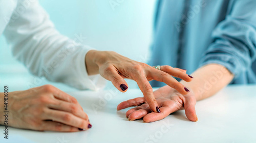 Examining Hand of Senior Patient with Carpal Tunnel Syndrome. 