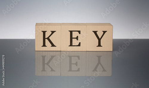 KEY word made with building blocks isolated on grey background