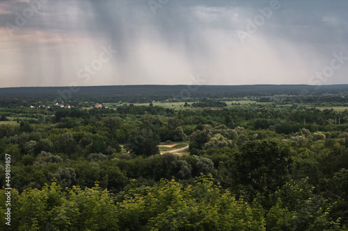 Beautiful summer landscape from the observation deck in Vladimir. Nature of Russia. Russian landscape in cloudy weather. The city of Vladimir - top view.