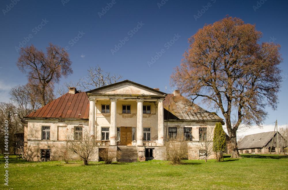Macitajmuiza manor near Kandava in sunny spring day, Latvia.