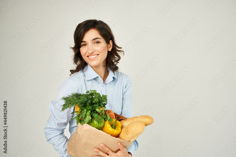 cheerful woman with a package of groceries supermarket shopping lifestyle cheerful woman with a package of groceries supermarket shopping lifestyle