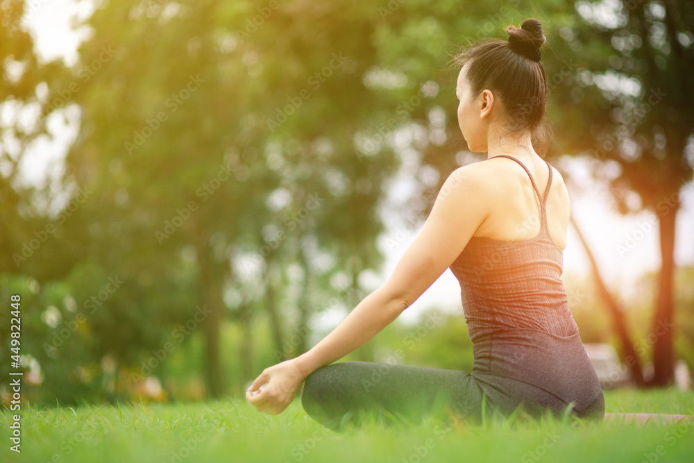 young woman doing yoga outdoor exercise morning sunrise for meditation and relaxation  concept of health care