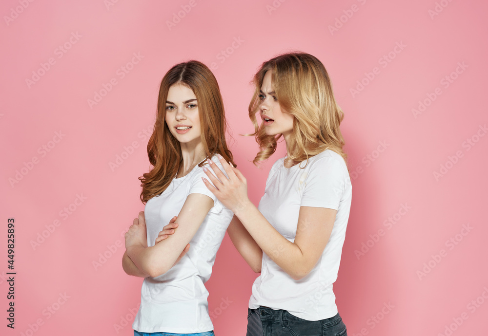 two pretty women stand side by side in white t-shirts fun modern verse two pretty women stand side by side in white t-shirts fun modern verse