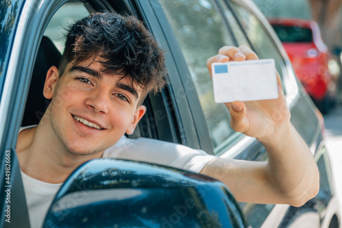 Bild auf Leinwand young nobel in the car with driver's license