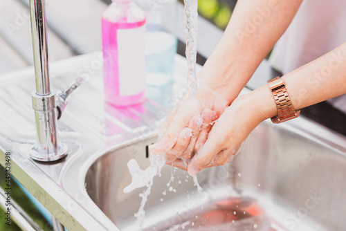 woman washing hands with soap After that  wash with alcohol gel before eating lunch. This is to take care of health care to prevent bacteria and far away from the spread of the coronavirus covid 19.