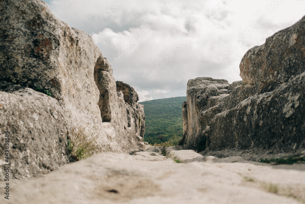 Main road between caves in ancient stone town-fortess Eski-Kermen. Bakhchysarai, Crimea.