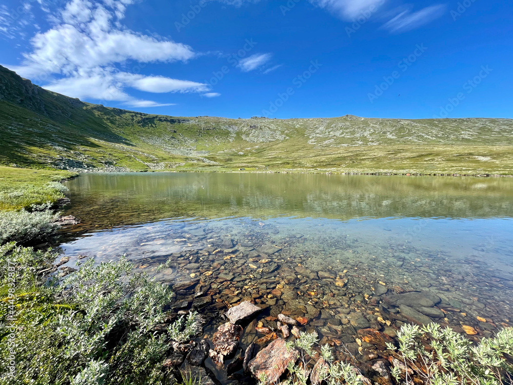 The lake at the foot of Mount Otorten in summer. Northern Ural, Russia