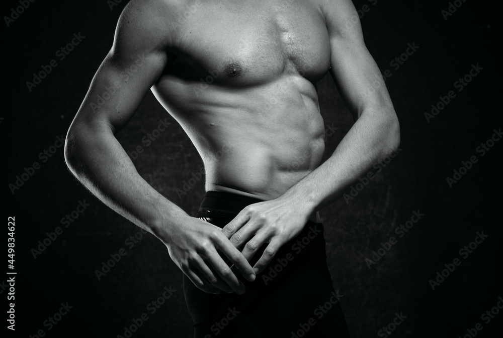 sporty man naked torso inflated body posing dark background sporty man naked torso inflated body posing dark background