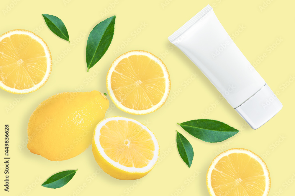 Lemon skin care cream lotion in plastic tube isolated on yellow background. Lemon skin care cream lotion in plastic tube isolated on yellow background.