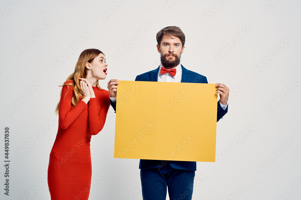 young couple with yellow mockup advertising emotions sale Copy Space young couple with yellow mockup advertising emotions sale Copy Space