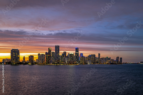 City of Miami Florida  sunset panorama with business and residential buildings and bridge on Biscayne Bay. Skyline night view.