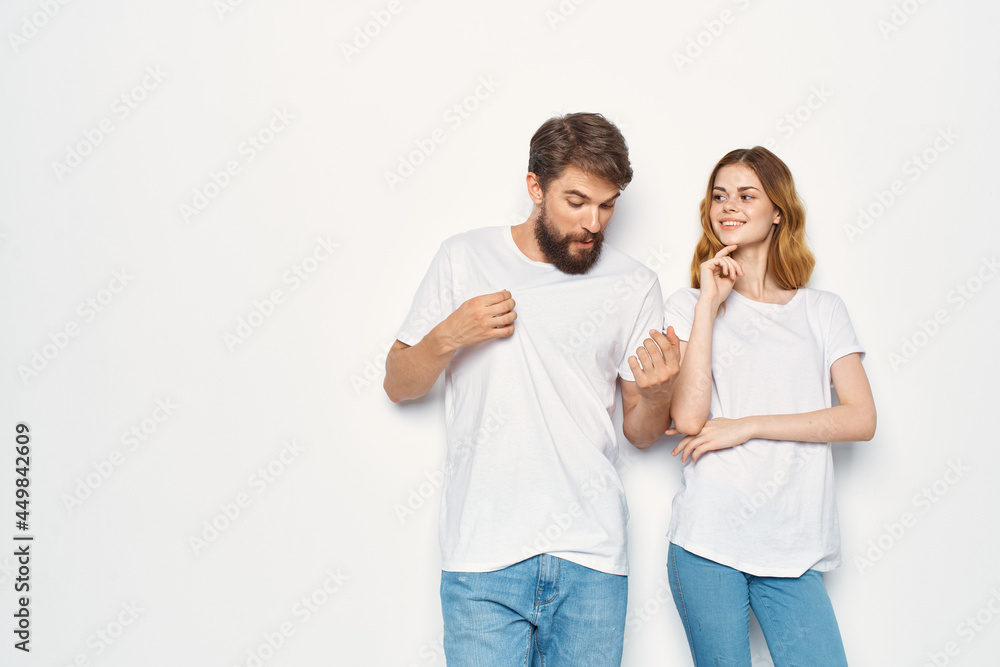 man and woman wearing white t-shirts fashion studio design casual wear man and woman wearing white t-shirts fashion studio design casual wear